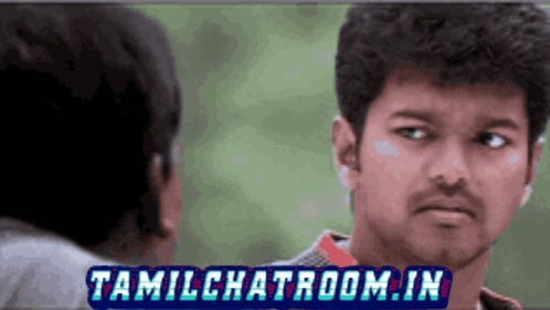 A Man Looking At Another Man With Tamilchatroom.in Written On The Bottom Right GIF