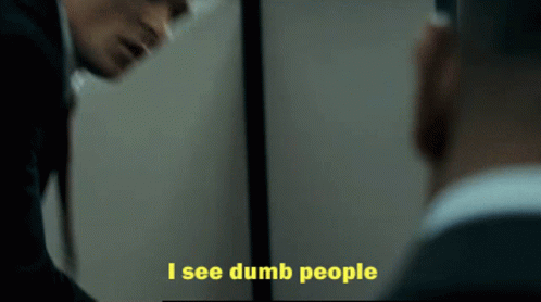 A Man Looking At Himself In A Mirror With The Words I See Dumb People Below Him GIF