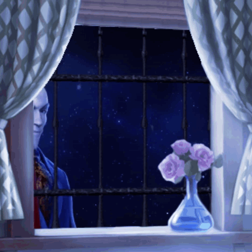 A Man Looking Out A Window With A Vase Of Flowers GIF