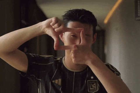 A Man Making A Frame With His Hands With The Letter L On It GIF