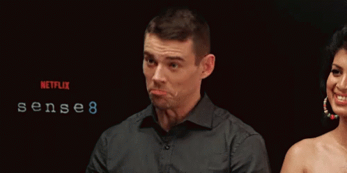 A Man Making A Funny Face In Front Of A Netflix Logo GIF