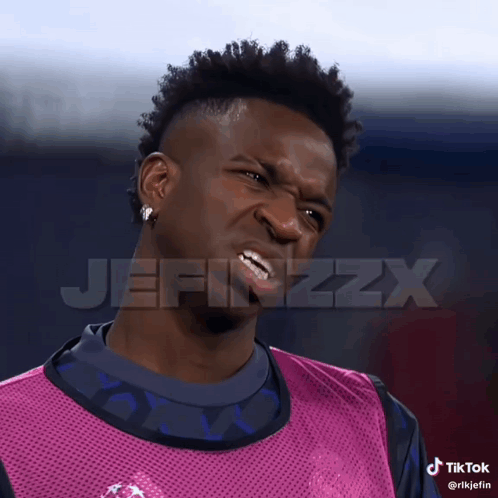 a man making a funny face with the word jefinzzx on the bottom