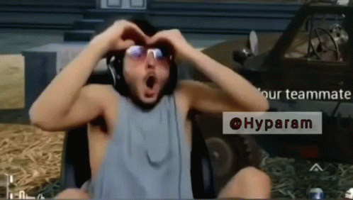 A Man Making A Heart Shape With His Hands While Wearing Sunglasses GIF