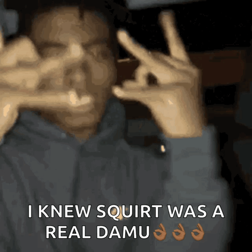 A Man Making A Peace Sign With His Hands And The Words I Knew Squirt Was A Real Damu GIF
