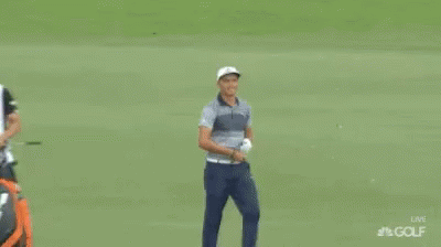 A Man Named Rickie Fowler Is Standing On A Green GIF