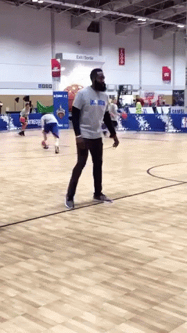 A Man On A Basketball Court Wearing A Shirt That Says Lsu Bruins GIF
