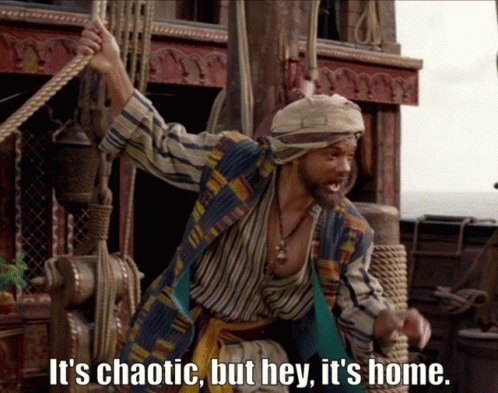 A Man On A Boat With The Words It 'S Chaotic But Hey It 'S Home Below Him GIF