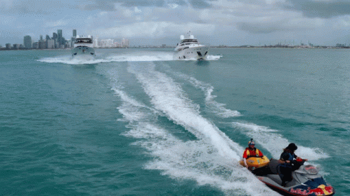 A Man On A Jet Ski That Says Red Bull GIF