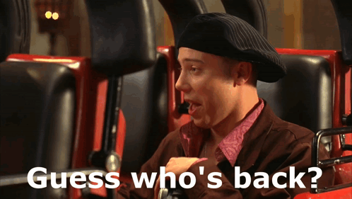 A Man On A Roller Coaster With The Words Guess Who 'S Back GIF