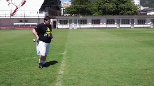 a man on a soccer field wearing a shirt that says ' be a ' on it