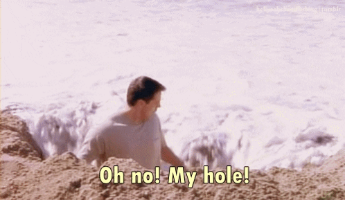 A Man On The Beach Says " Oh No! My Hole " GIF