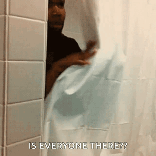 A Man Peeking Out From Behind A Shower Curtain With The Words Is Everyone There GIF