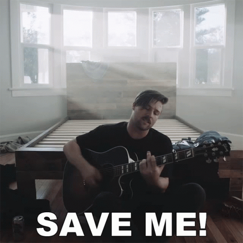 A Man Playing A Guitar In Front Of A Bed With The Words Save Me Written Below Him GIF