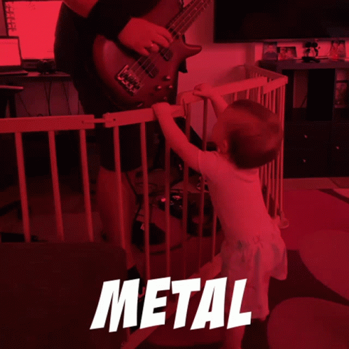 A Man Playing A Guitar Next To A Little Girl With The Word Metal On The Bottom Right GIF