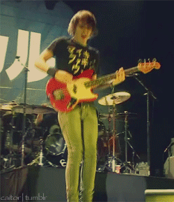 A Man Playing A Guitar On A Stage With A Cator Tumblr Watermark GIF