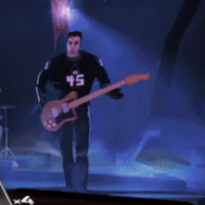 A Man Playing A Guitar With A 45 On His Shirt GIF