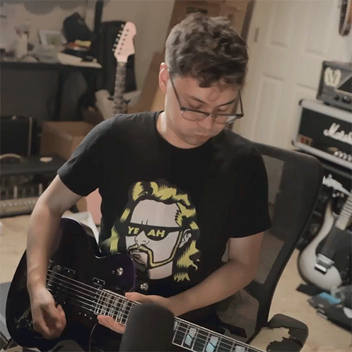Man Playing Guitar With Yeah Shirt GIF