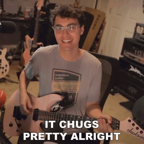 A Man Playing A Guitar With The Words " It Chugs Pretty Alright " On The Bottom GIF