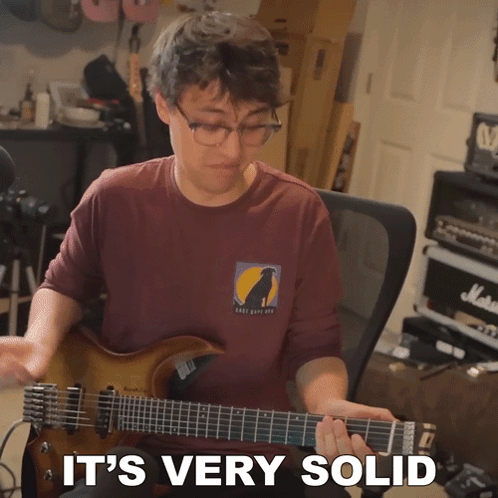 Man Playing Guitar With Very Solid GIF