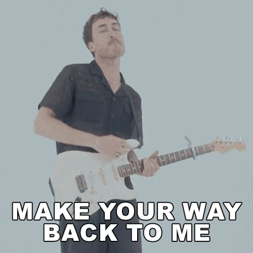 A Man Playing A Guitar With The Words Make Your Way Back To Me GIF