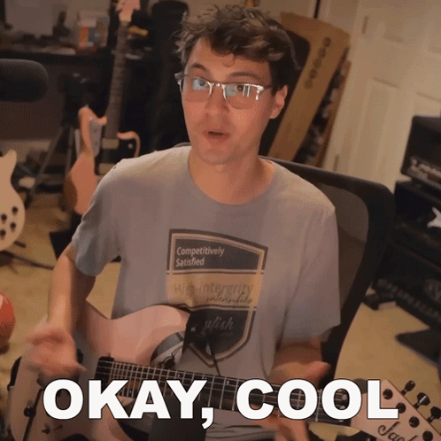 A Man Playing A Guitar With The Words Okay Cool Written Below Him GIF