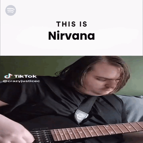 A Man Playing A Guitar With The Words " This Is Nirvana " Behind Him GIF
