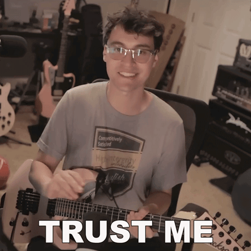 Man Playing Guitar With Trust Me Text GIF