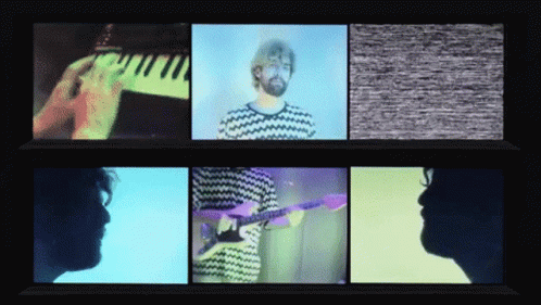 A Man Playing A Piano And A Man Playing A Guitar GIF