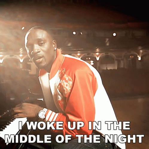 A Man Playing A Piano With The Words I Woke Up In The Middle Of The Night GIF