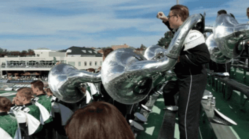 a man playing a trumpet in a marching band with the word ohio on it