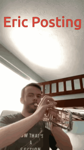 A Man Playing A Trumpet With The Name Eric Posting Written Above Him GIF