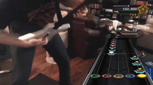 A Man Playing A Video Game With 153,700 Points On The Screen GIF