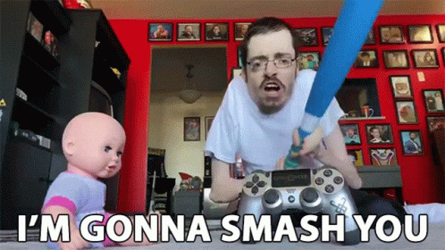 A Man Playing A Video Game With The Words I 'M Gonna Smash You Behind Him GIF
