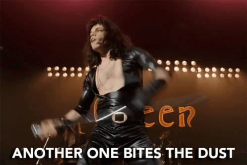 A Man Playing A Violin With The Words Another One Bites The Dust Written Below Him GIF