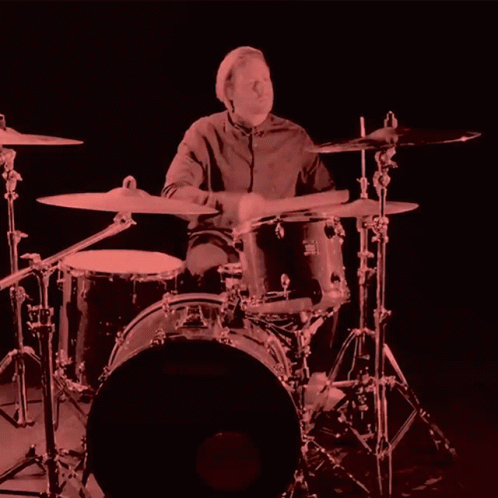 A Man Playing Drums With A Drum Set That Says Yamaha GIF
