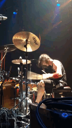 A Man Playing Drums With A Sabian Cymbal GIF