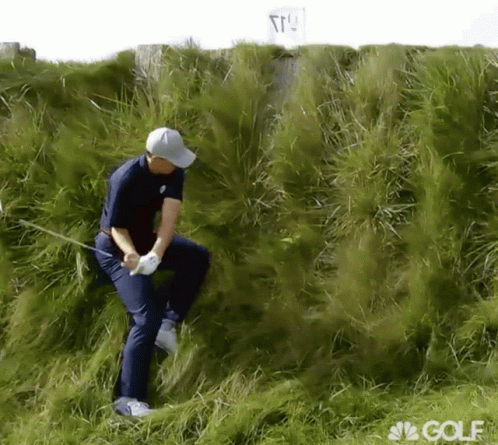 A Man Playing Golf In A Field With A Nbc Golf Logo On The Bottom GIF