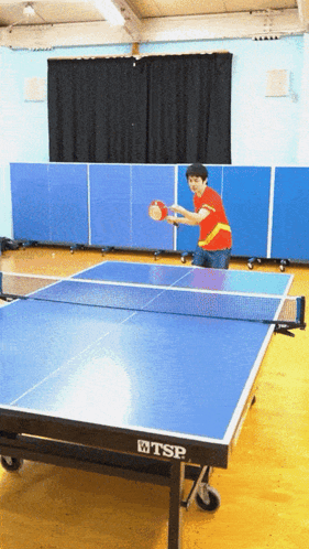 A Man Playing Ping Pong With A Tsp Table GIF