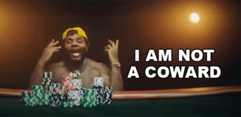 A Man Playing Poker With The Words I Am Not A Coward GIF