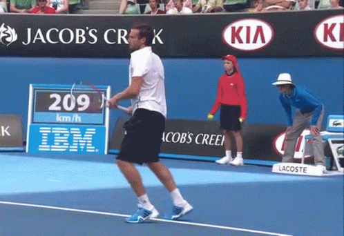 A Man Playing Tennis On A Court With Jacob 'S Creek In The Background GIF