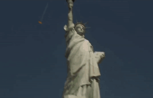 A Man Pointing At The Twin Towers In New York GIF