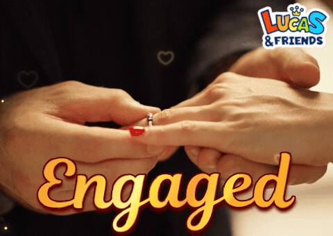 a man putting a ring on a woman 's finger with the words engaged below