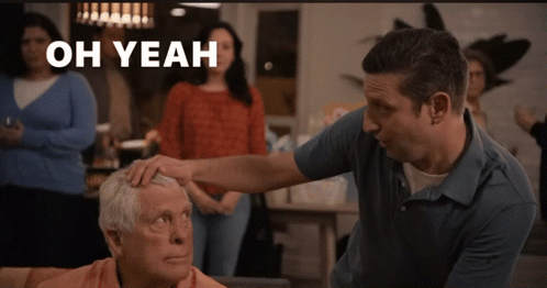 A Man Putting His Hand On An Older Man 'S Forehead With The Words Oh Yeah Above Him GIF