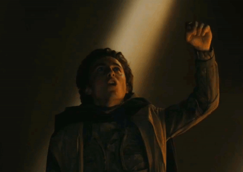 A Man Raising His Hand With The Words The Hand Of God Be My Witness Above Him GIF