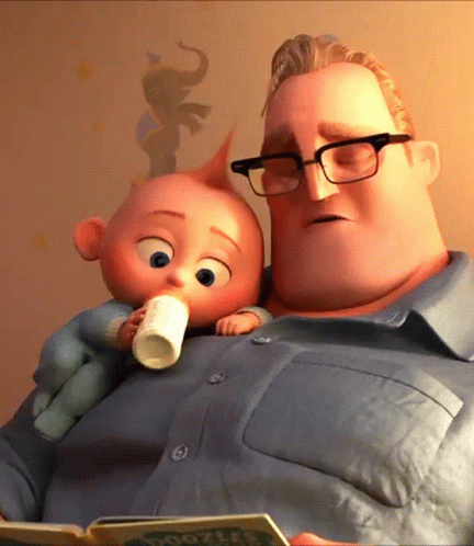 A Man Reading A Book While Holding A Baby With A Bottle In His Hand GIF