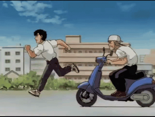 A Man Riding A Blue Scooter Is Running Behind Another Man GIF