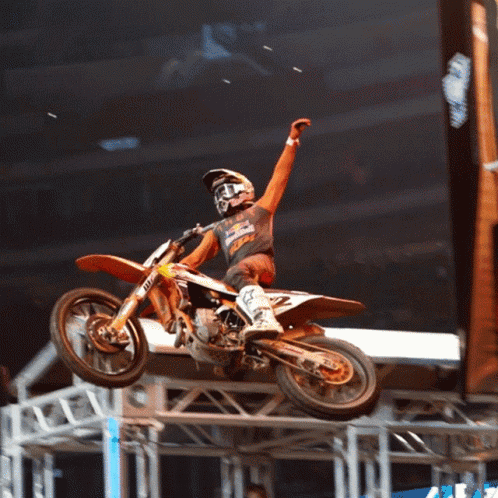 A Man Riding A Dirt Bike With The Number 2 On The Back GIF