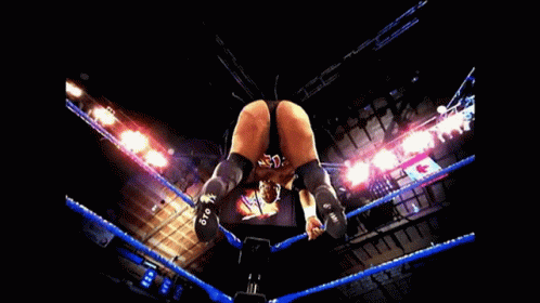A Man 'S Butt Is Shown In A Wrestling Ring With Blue Ropes GIF