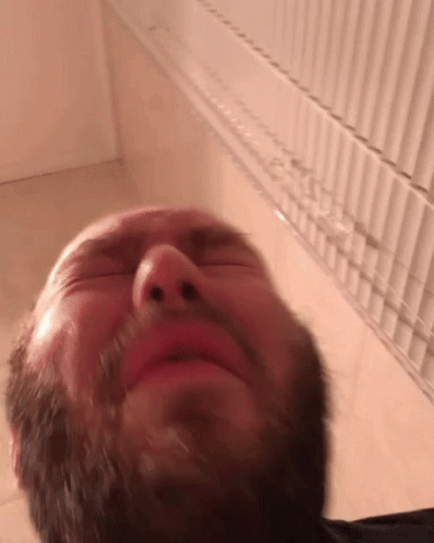 A Man's Close Up Sneeze GIF