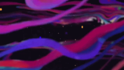 A Man 'S Face Is Glowing In A Purple And Blue Light GIF